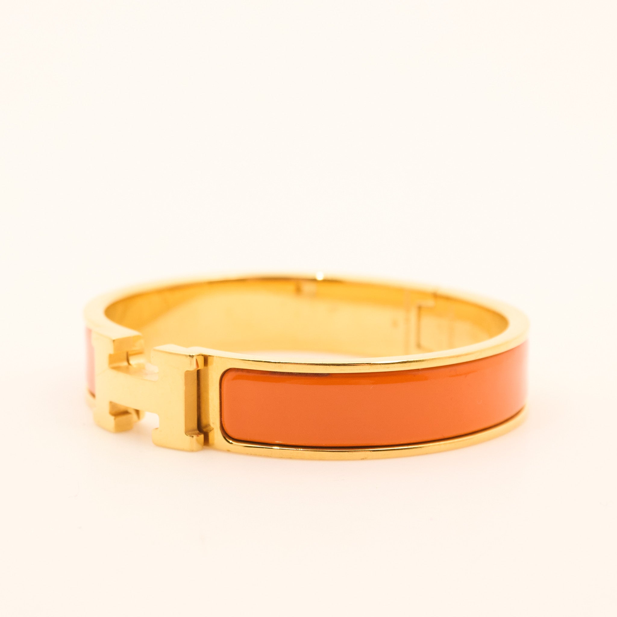 Hermès Clic H Bracelet in Orange and Gold PM