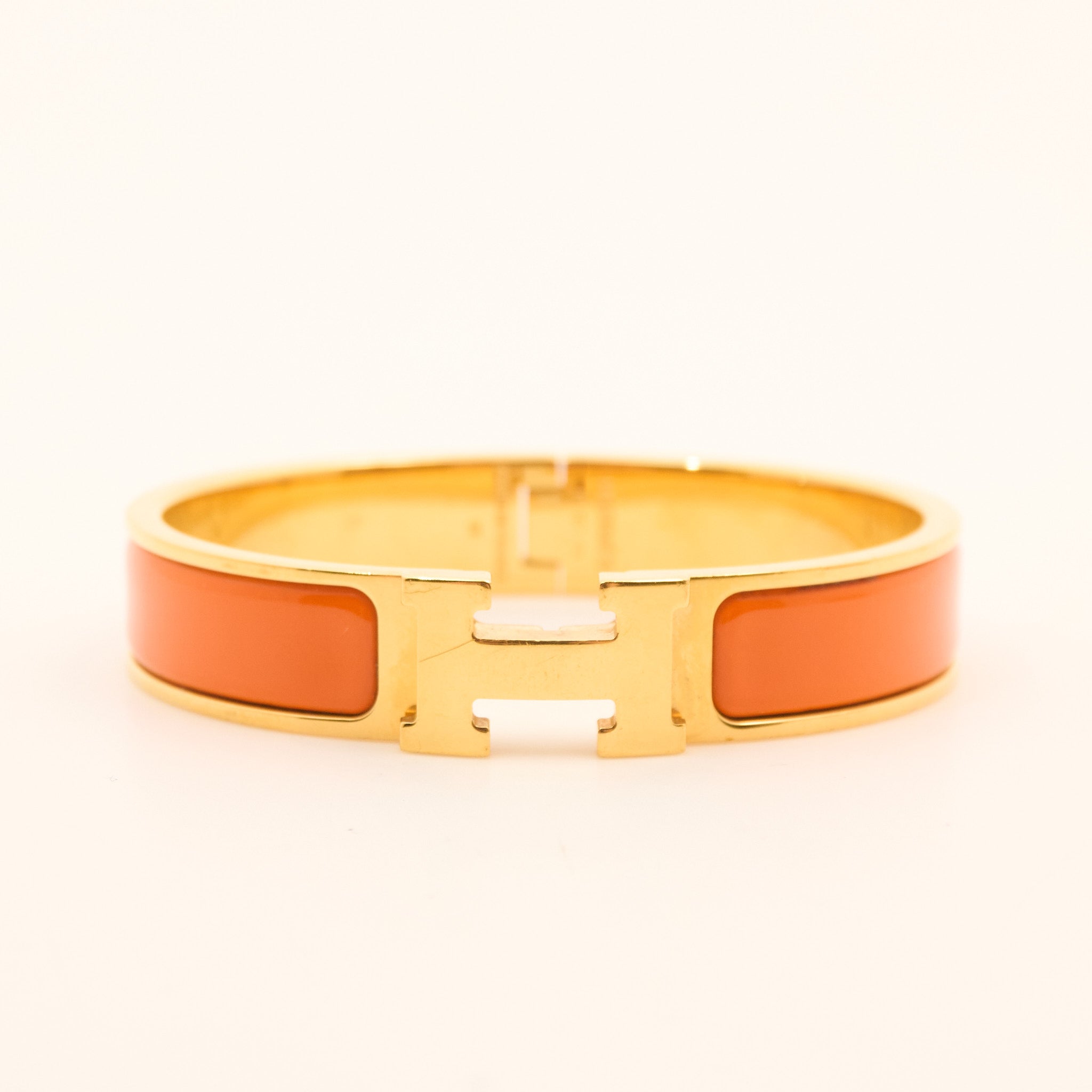Hermès Clic H Bracelet in Orange and Gold PM