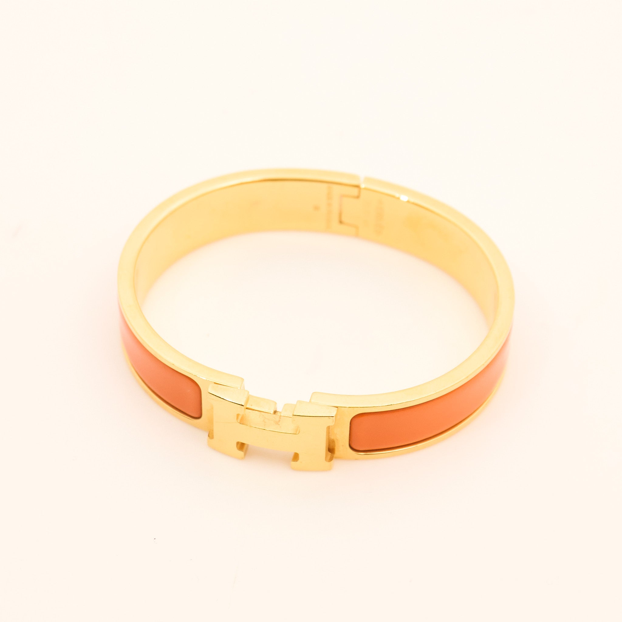 Hermès Clic H Bracelet in Orange and Gold PM