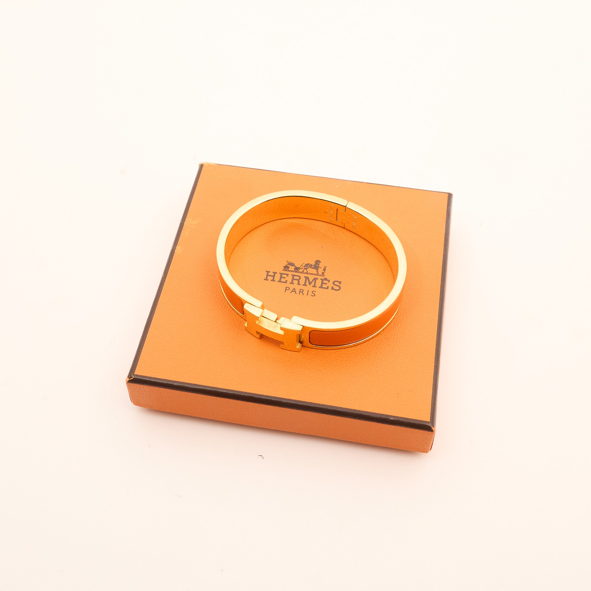 Hermès Clic H Bracelet in Orange and Gold PM